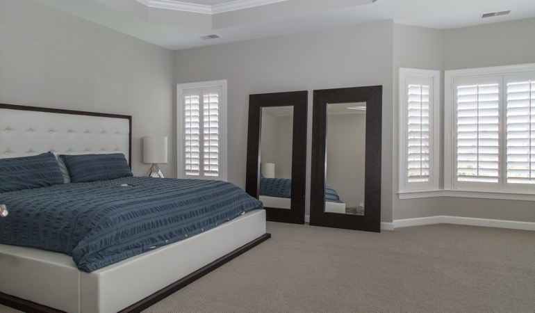 Polywood shutters in a minimalist bedroom in Destin.